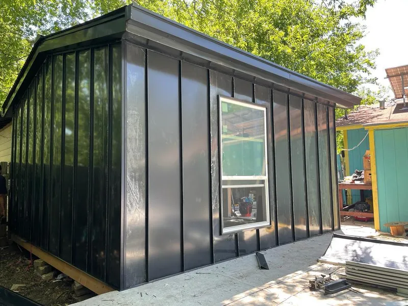 Black standing seam metal wall panels for Roof Inspection in Ludington