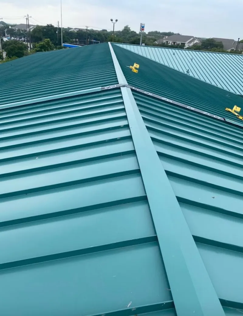 Green commercial metal roof ridge and valley for Metal Roof Repair in Ludington