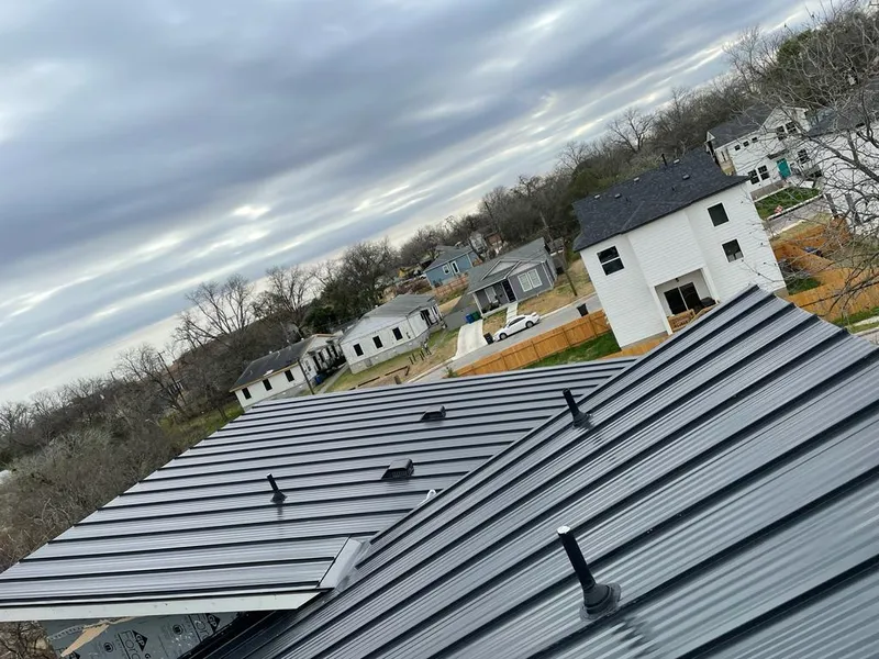 Standing seam metal roof panels with vents for Skylight Repair in Ludington